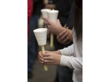 People attend a candlelight vigil outside the Gordon Oakes Red Bear Student Centre on the University of Saskatchewan campus to support those affected by the tragedies of youth suicides in northern Saskatchewan, October 20, 2016.