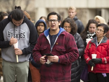 People attend a candlelight vigil outside the Gordon Oakes Red Bear Student Centre on the University of Saskatchewan campus to support those affected by the tragedies of youth suicides in northern Saskatchewan, October 20, 2016.