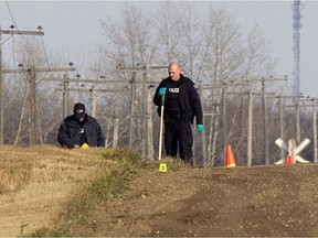 RCMP investigate on a road between Valley Road and the Pike Lake highway (#60)  on Monday, October 24, 2016 after the discovery of a body.