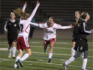 Centennial Chargers #14 McKenna Olson (C) celebrates a go-ahead goal with teammate #2 Shayla Lukey in a match against the St. Joseph Guardians during the city high school girls final from SMF Field, October 24, 2016.