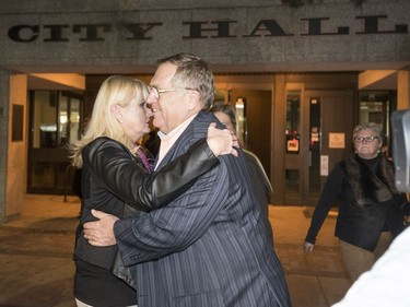 Former mayor Don Atchison gets a hug from newly elected Ward 9 city councillor Bev Dubois outside of City Hall in Saskatoon, October 26, 2016.