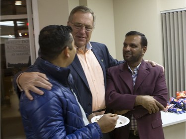 Don Atchison with supporters Kamanashis Deb (L) and Sadiqur Rahmn  in his campaign headquarters while waiting on the results of the civic election, October 26, 2016.