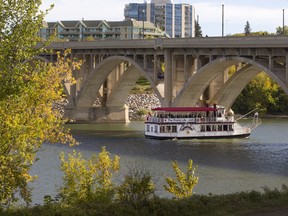 The Prairie Lily riverboat cruises the South Saskatchewan surrounded by fall colours.