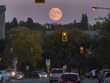A full moon rises over Saskatoon, September 15, 2016.