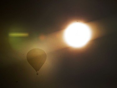 A hot air balloon floats over Saskatoon, September 20, 2016.