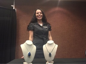 Serese Selanders, founder and CEO of Kasiel Soultions Inc., poses with her company's new product, a wearable medical alert device called Ora.