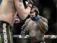 This Jan. 24, 2015 file photo shows Anthony (Rumble) Johnson, right, of the U.S., fighting with Alexander "The Mauler" Gustafsson