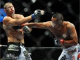 Dan Henderson connects with a right to Michael Bisping during their middleweight bout during UFC 100 on July 11, 2009 in Las Vegas, Nevada.