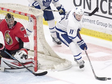 Toronto Maple Leafs forward Zach Hyman brings the puck around Ottawa Senators goalie Craig Anderson's net during the third period of an NHL pre-season hockey game in Saskatoon, October 4, 2016.