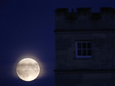 The moon rises with Syon House, in the foreground, in west London on November 13, 2016. Tomorrow, the moon will orbit closer to the earth than at any time since 1948, named a 'supermoon,' it is defined by a Full or New moon coinciding with the moon's closest approach to the Earth.