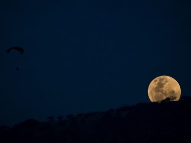 An unusually large and bright Moon — the closest supermoon to Earth in 68 years — adorns the night sky in Santiago on November 13, 2016.