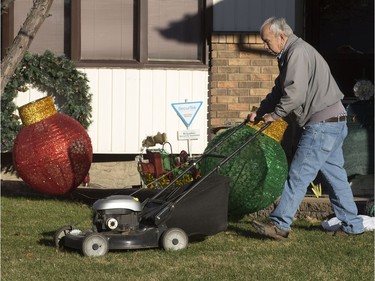 Christmas decorations and lawnmowers were juxtaposed in Adam Kolteski's front yard on November 14, 2016 as warm weather into November has allowed Saskatoon residents extra time to enjoy the outdoors.