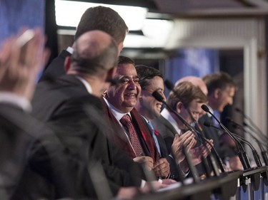 The conservative leadership candidates enjoy a lighter moment thanks to Deepak Obhrai (C) during the Conservative leadership debate in Saskatoon, November 9, 2016.