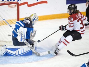 Canada's Emily Clark (39) is stopped by Finland's goaltender Meeri Raisanen during first period semifinal action at the women's world hockey championships in Kamloops, B.C., on Sunday, April 3, 2016.