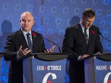 Conservative leadership candidate Erin O'Toole (L) speaks as Maxime Bernier listens during the Conservative leadership debate in Saskatoon, November 9, 2016.