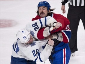 Former NHL enforcer George Parros , shown here in a battle with Colton Orr of the Toronto Maple Leafs back in 2013, now works for the NHL's department of player safety.