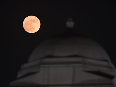 A supermoon rises behind India Gate in New Delhi on November 14, 2016. Skygazers headed to high-rise buildings, ancient forts and beaches on November 14 to witness the closest "supermoon" to Earth in almost seven decades, hoping for dramatic photos and spectacular surf. The moon will be the closest to Earth since 1948 at a distance of 356,509 kilometres, creating what NASA described as "an extra-supermoon."