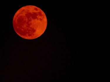 A supermoon rises near government buildings in central New Delhi on November 14, 2016. Skygazers headed to high-rise buildings, ancient forts and beaches on November 14 to witness the closest "supermoon" to Earth in almost seven decades, hoping for dramatic photos and spectacular surf. The moon will be the closest to Earth since 1948 at a distance of 356,509 kilometres, creating what NASA described as "an extra-supermoon."