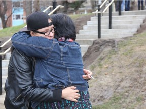 Michelle Burns (left), the twin sister of Monica Burns, shares an embrace during an adjournment shortly after Todd McKeaveney pleaded guilty to manslaughter at Prince Albert Court of Queen's Bench on, Nov. 8, 2016
