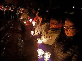 More than 250 people attended a candlelight vigil in the northern community of La Ronge on Nov. 1 to remember six young girls who recently lost their lives to suicide.