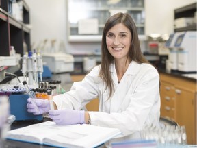 Natalie Blain studies bacteria in plant roots. (photo by David Stobbe for University of Saskatchewan)