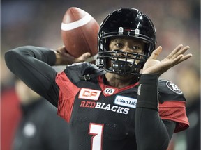 Ottawa Redblacks quarterback Henry Burris (1) passes against the Calgary Stampeders during first quarter CFL Grey Cup action Sunday, November 27, 2016 in Toronto.