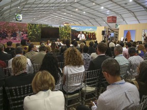 People attend a panel featuring Canadian Indigenous leaders discussing climate change, at the COP22 climate change conference in Marrakech, Morocco, Wednesday, Nov. 16, 2016.