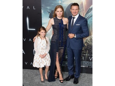 L-R: Abigail Pniowsky, Amy Adams and Jeremy Renner arrive for the premiere of Paramount Pictures' "Arrival" at Regency Village Theatre on November 6, 2016 in Westwood, California.