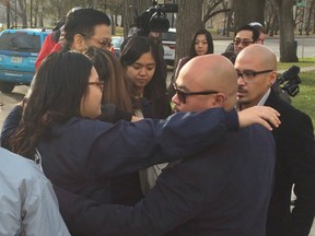 The family of Lorry Ann Santos hugged outside Saskatoon Court of Queen's Bench on Nov. 3, 2016, after Joshua Petrin was convicted of first-degree murder in her 2012 death