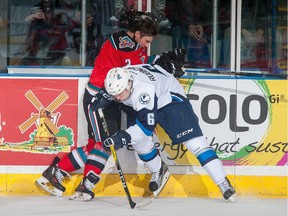 Mark Rubinchik (6) of Saskatoon Blades. shown here hitting Riley Stadel (3 )of Kelowna Rockets, is ranked among the top 31 prospects for the 2017 NHL Entry Draft.