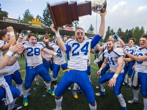 James Vause hoists the big championship trophy as he and the Saskatoon Hilltops celebrate a 37-25 Canadian Bowl victory in 2016 over the host Westshore Rebels in Langford, B.C.