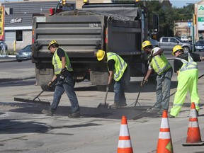 File photo of city crews repairing a section of Eighth Street.
