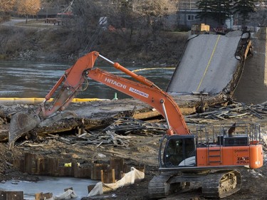 The large equipment on the demolition site is making short work with the clean up of the last span of the traffic bridge, which was collapsed to the ground the day before, November 18, 2016.