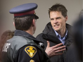 SASKATOON, SASK--NOVEMBER 20 2015 1121 news lighthouse shelter-City Councillor for Ward 6, Charlie Clark, speaks with a member of the Saskatoon Police prior to a media event announcing expansions to the Lighthouse shelter on Friday, November 20th, 2015. (Liam Richards/the StarPhoenix)