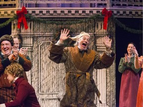 Kent Allen (centre) stars as Ebenezer Scrooge in Persephone Theatre's A Christmas Carol.