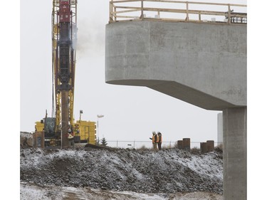Piling being pounded into the ground where the west entrance will be at the North Commuter Bridge construction site during a media tour showing the progress on the westside pillars, with the second close to completion, November 23, 2016.