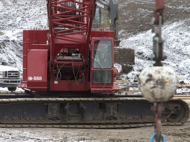 Crane operator at the North Commuter Bridge construction site during a media tour showing the progress on the westside pillars, with the second close to completion, November 23, 2016.