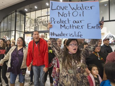 A flash mob broke out in Midtown Plaza in Saskatoon, singing at the top of their lungs in protest, making sure Mother Earth is protected and there is always safe water to drink, November 3, 2016.