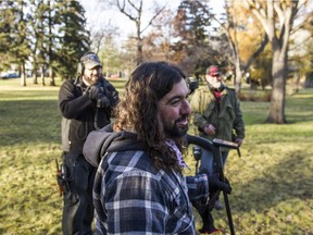 Yasha Rassi (centre) discusses metal detecting with Walt Degenstein (left) and John Cave (right) in Saskatoon on Nov. 5, 2016.