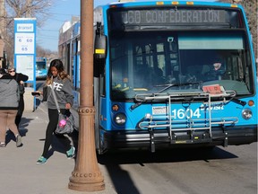 Passengers get off the bus at their stop near the bus mall in Saskatoon on November 11, 2016.