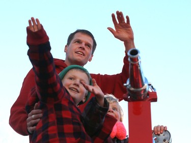 Mayor Charlie Clark waves to the crowd during his first Santa Claus parade as mayor downtown Saskatoon on November 20, 2016.