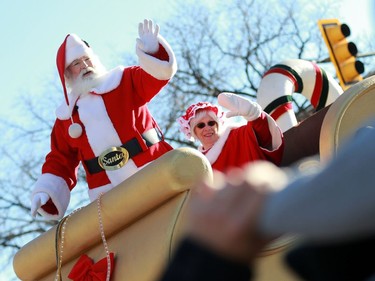 Santa and Mrs. Claus wave to the crowd, closing off the annual Santa Claus Parade downtown Saskatoon on November 20, 2016.