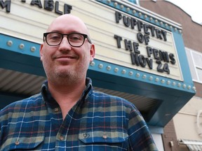 Broadway Theatre Executive and Artistic Director Kirby Wirchenko poses in front of the Puppetry of the Penis sign outside the Broadway Theatre in Saskatoon on November 22, 2016.