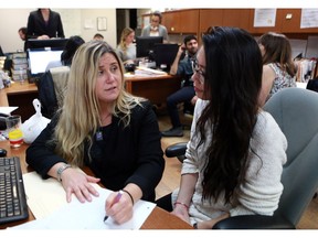 Chantelle Johnson, CLASSIC Executive Director, discusses their upcoming fundraiser with Taylor-Anne Yee, one of CLASSIC's student managers at their office on 20th Street in Saskatoon. (Michelle Berg / The StarPhoenix)