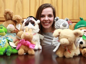 Miren Luczka is surrounded by stuffed animals at the StarPhoenix.