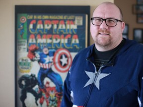Beau Sutton, an American living in Saskatoon who fears a Donald Trump presidency, is pictured in front of his Captain America poster in his home on November 6, 2016. (Michelle Berg / Saskatoon StarPhoenix)