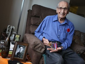 Peter Kostiuk is the oldest surviving Ukrainian WWII veteran in Saskatchewan. Here he is in his Saskatoon home on November 6, 2016. (Michelle Berg / Saskatoon StarPhoenix)