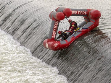 Saskatoon Fire Department water rescue team trains at the weir November 8, 2016, including going over the weir on the SFD Rescue Craft and practicing rescue skills that include exiting the rotation of the fast current.