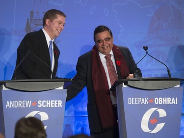 Candidates Andrew Scheer (L) and Deepak Obhrai participate in the Conservative Party's first leadership debate in Saskatoon, moderated by Kaveri Braid, November 9, 2016.