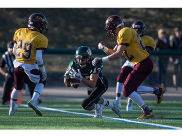 Holy Cross Crusaders receiver Steven Gilewiez drops a pass in the end zone against the LeBoldus Golden Suns during the High school football 4A provincial final at SMS field in Saskatoon, SK. on Saturday, November 12, 2016. (LIAM RICHARDS/THE STAR PHOENIX)